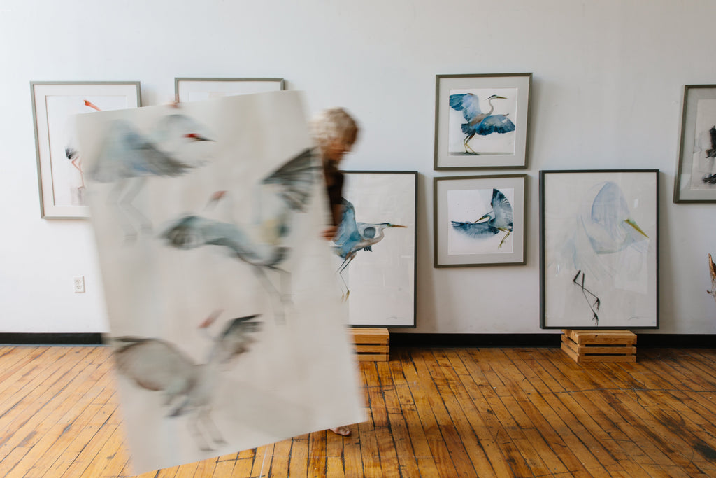 Holly Wach at her Fall Open Studio Providence showcasing her original watercolor bird paintings.