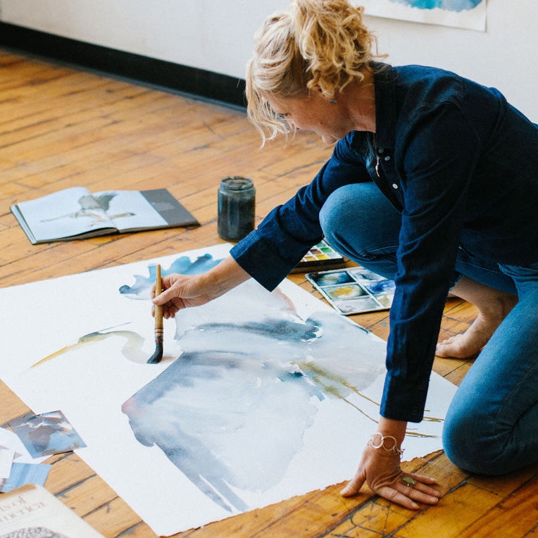 Holly Wach paints sumi-e style on the floor