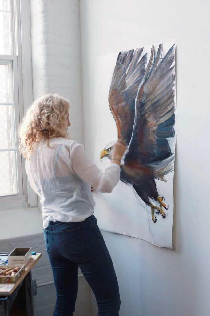 Holly Wach draws an original raptor pastel work of art