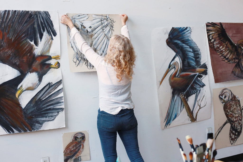 Holly Wach draws an original raptor pastel work of art