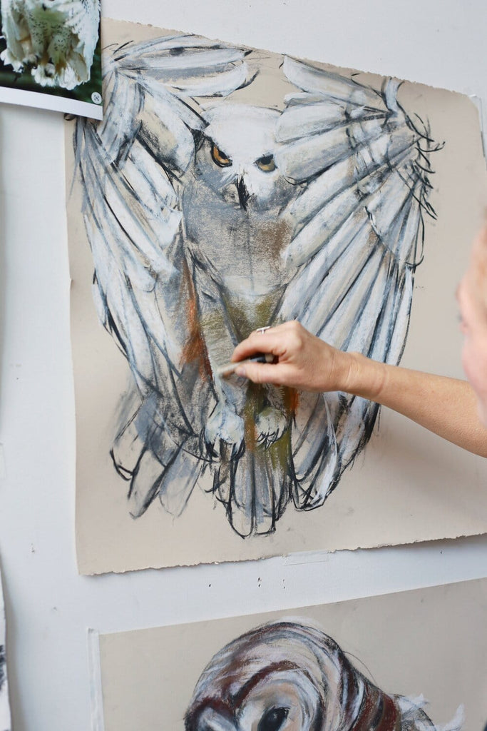 Holly Wach draws an original raptor pastel work of art