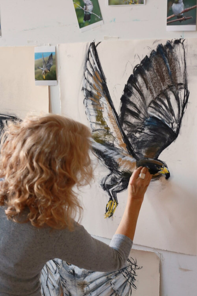 Holly Wach draws an original raptor pastel work of art